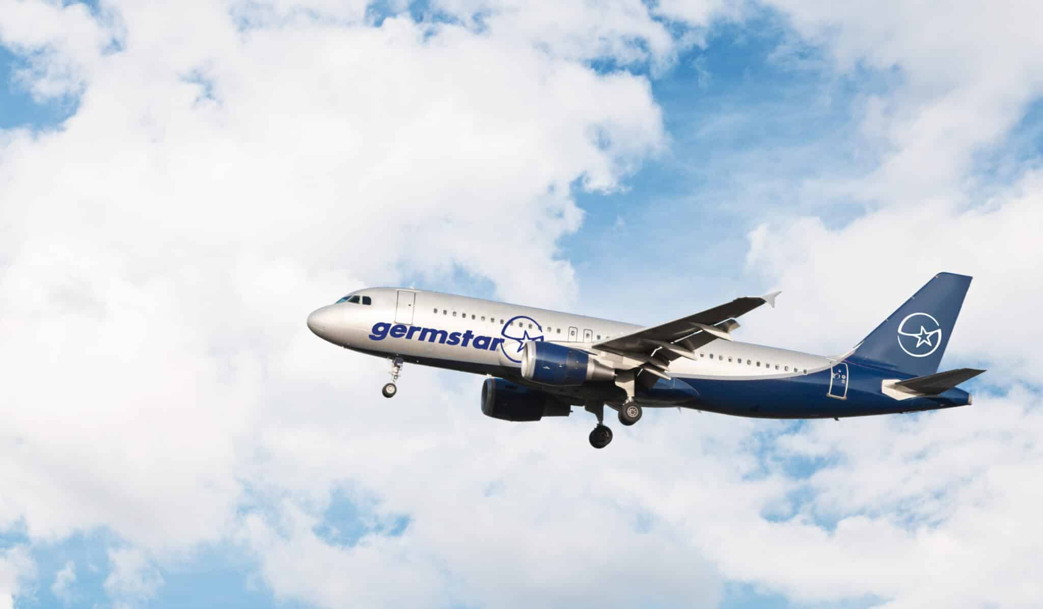 Airplane flying in a cloudy sky